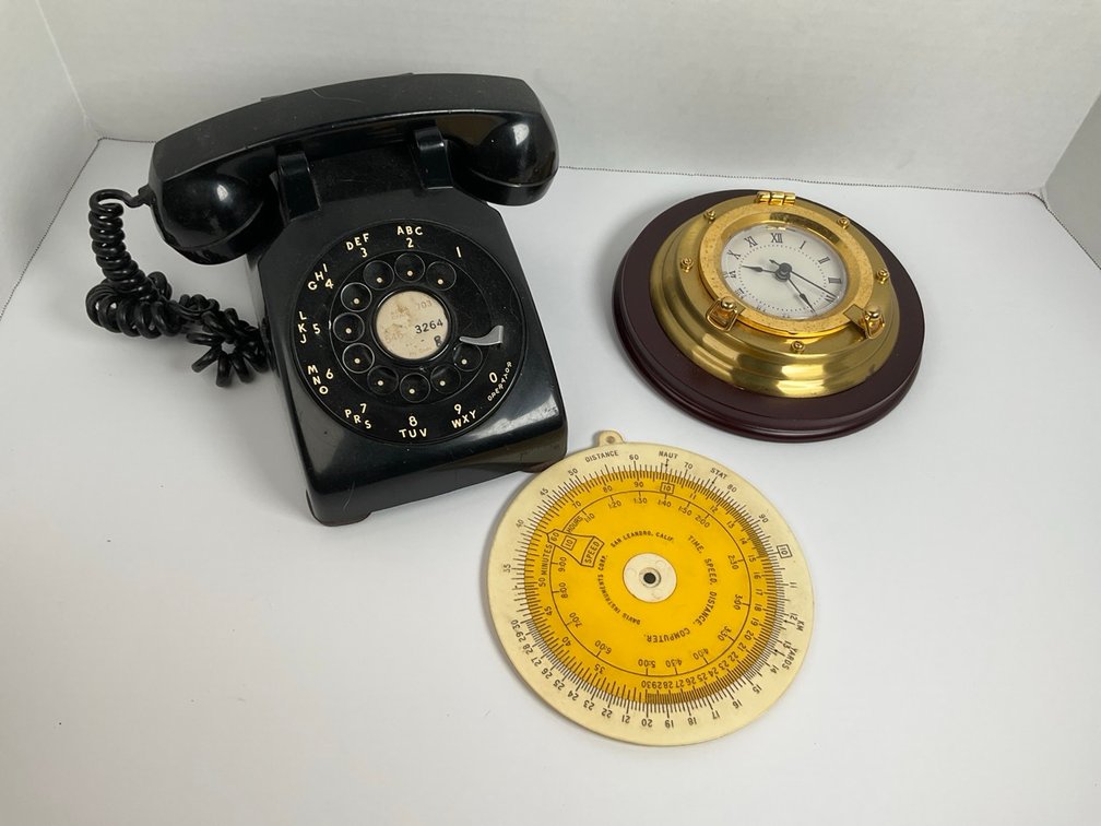 Rotary Telephone, Brass Porthole Clock, and Davis T-S-D Computer