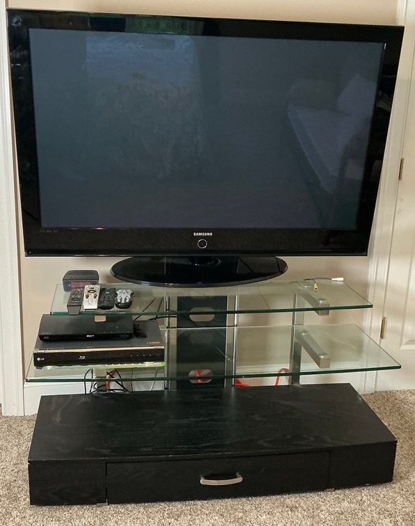 Samsung Plasma TV With Glass Entertainment Stand and Contents