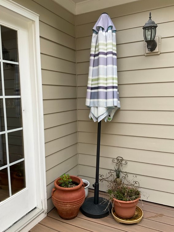 Striped Patio Market Umbrella with Base and Terracotta Planters