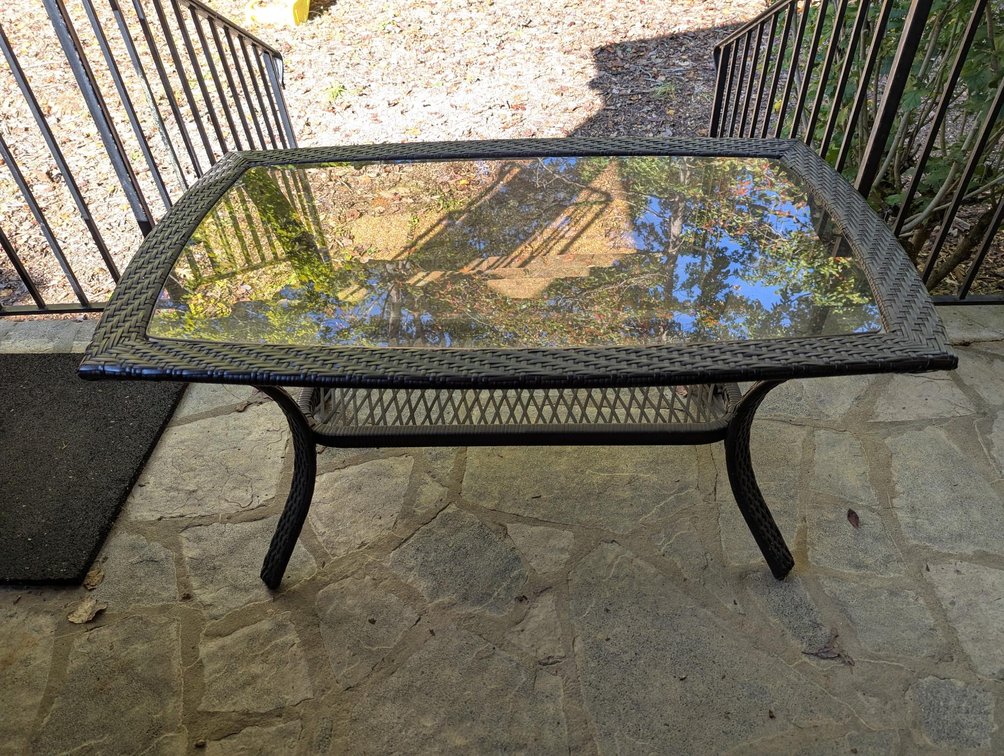 Brown Woven Resin Wicker Outdoor Coffee Table Featuring Inset Glass