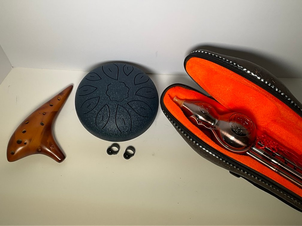 Assorted World Folk Musical Instruments Hulusi Ocarina and Tongue Drum