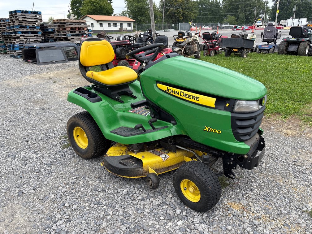 D4b. John Deere x300 tractor with 42”