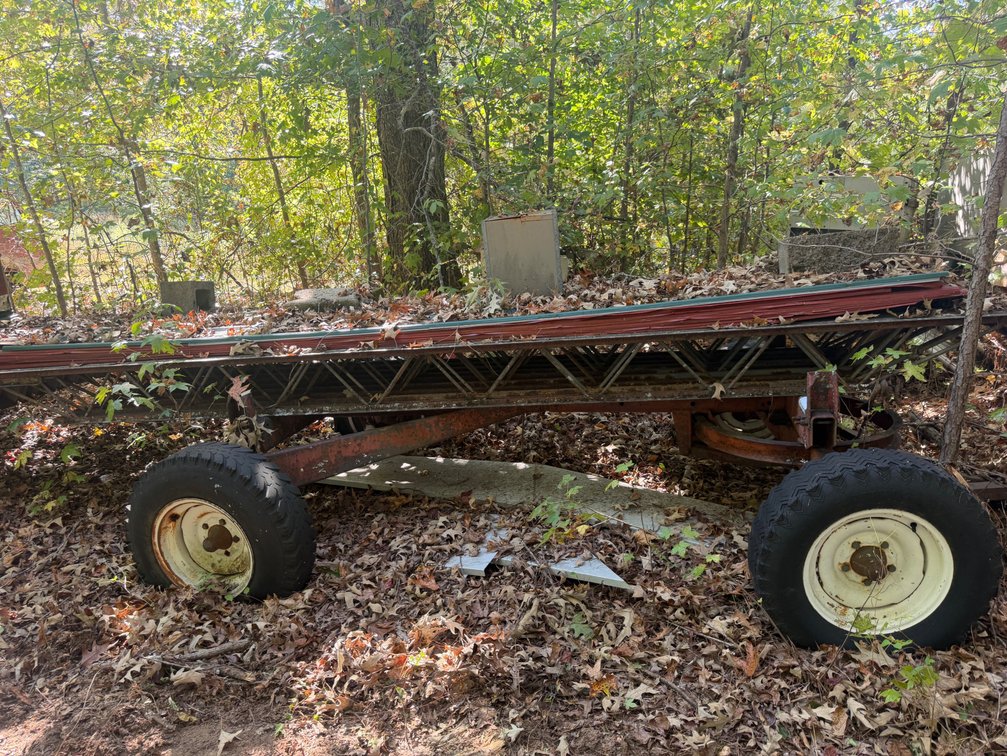 4 wheel trailer with building trusses and tin