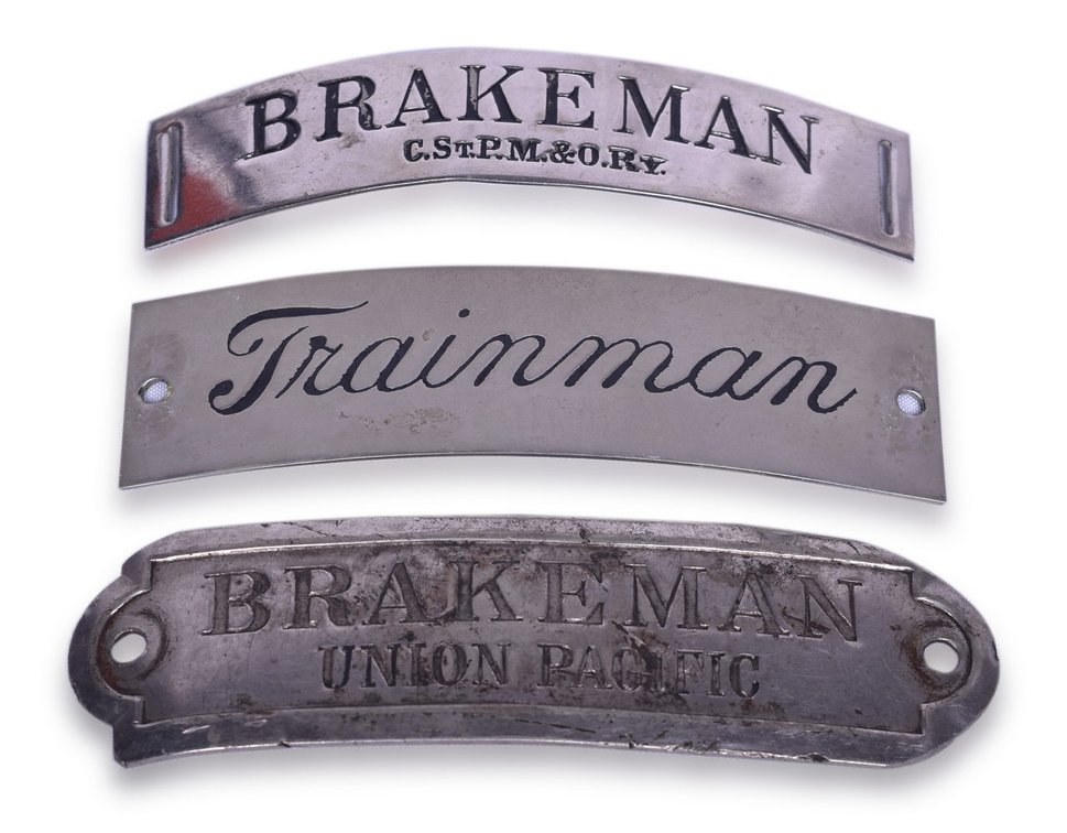 Three Railroad Nickel Cap Badges - C.St.P.M&O "Brakeman", "Trainman", and Union Pacific "Brakeman"