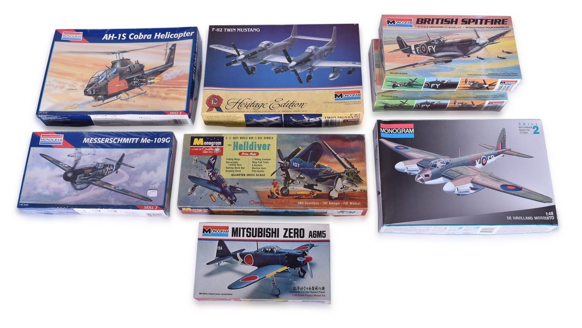 Eight Unassembled Monogram Scale Model Plane Kits - Helldiver, British Spitfire, Mitsubishi Zero A6M5, Cobra Helicopter, and More