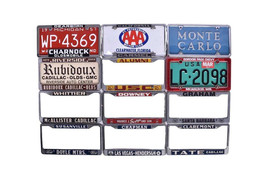 Eleven License Plate Frames - Dealerships Oldsmobile and Cadillac