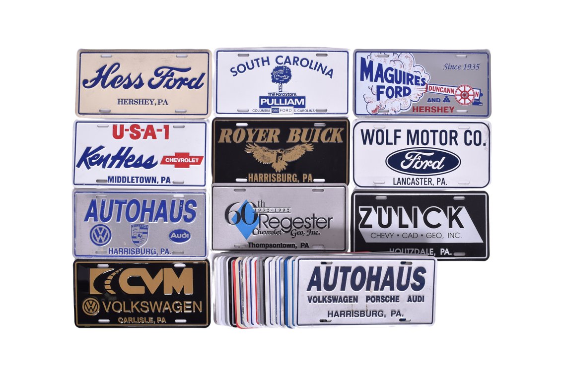 Thirty-Nine Stamped Metal Automobile License Plate Inserts