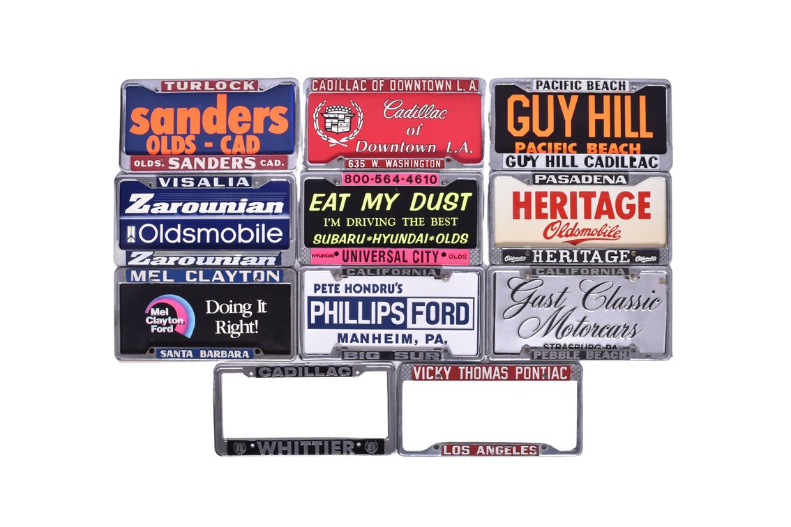 Eleven License Plate Frames - Dealerships Oldsmobile, Cadillac, Pontiac, Ford