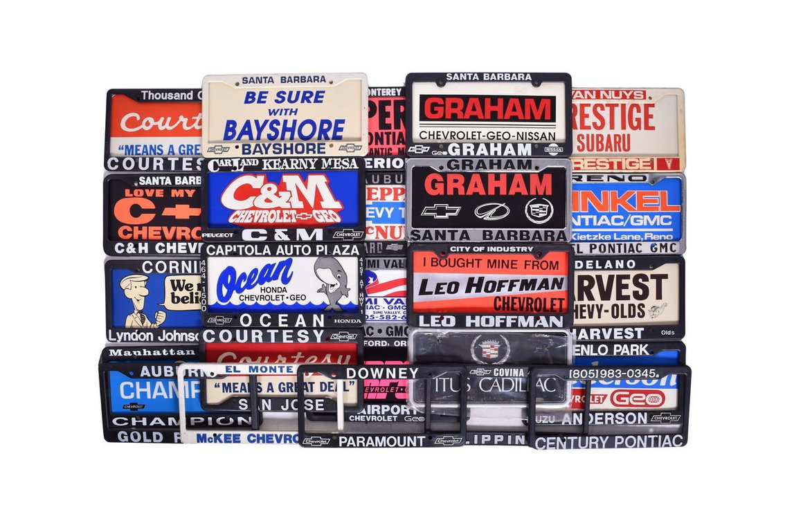 Twenty-Four Plastic and Metal License Plate Frames - Dealerships Pontiac and Chevrolet