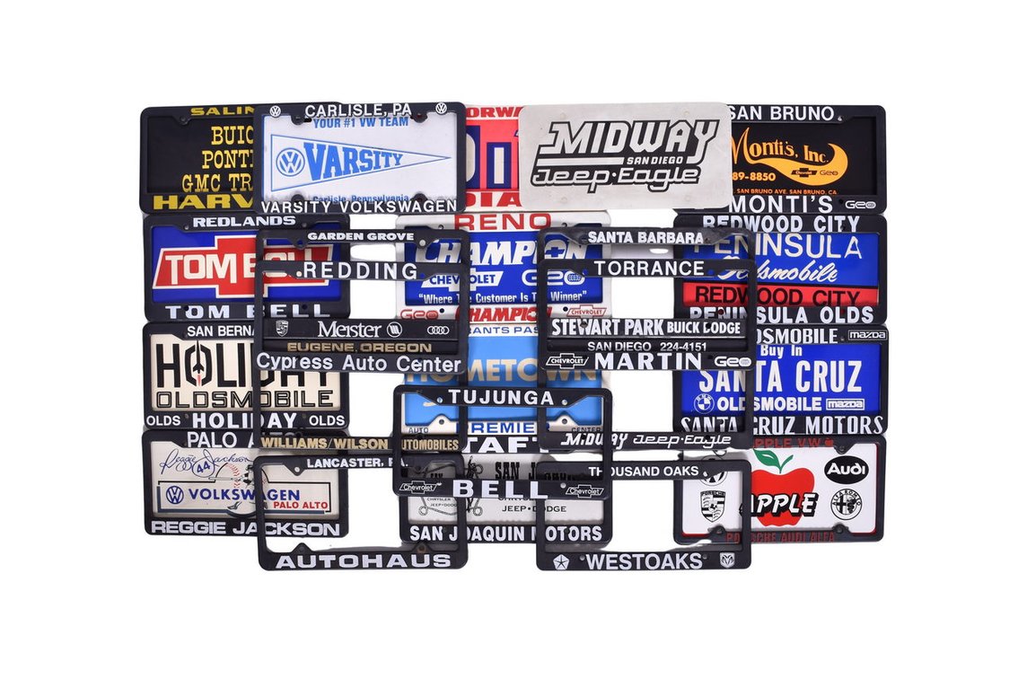 Twenty-Two Plastic License Plate Frames - Dealerships Chevrolet, Oldsmobile, and More