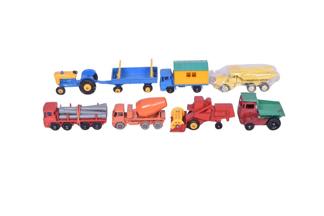 Eight Matchbox Lesney and Dinky Vehicles - No. 39 Ford, No. 40 Hay Trailer, No. 60 Site Hut, No. 2 Muir Hill, No. 65 Claas, No. 10 Pipe Truck, No. 26 Foden, and No. 97 Euclid