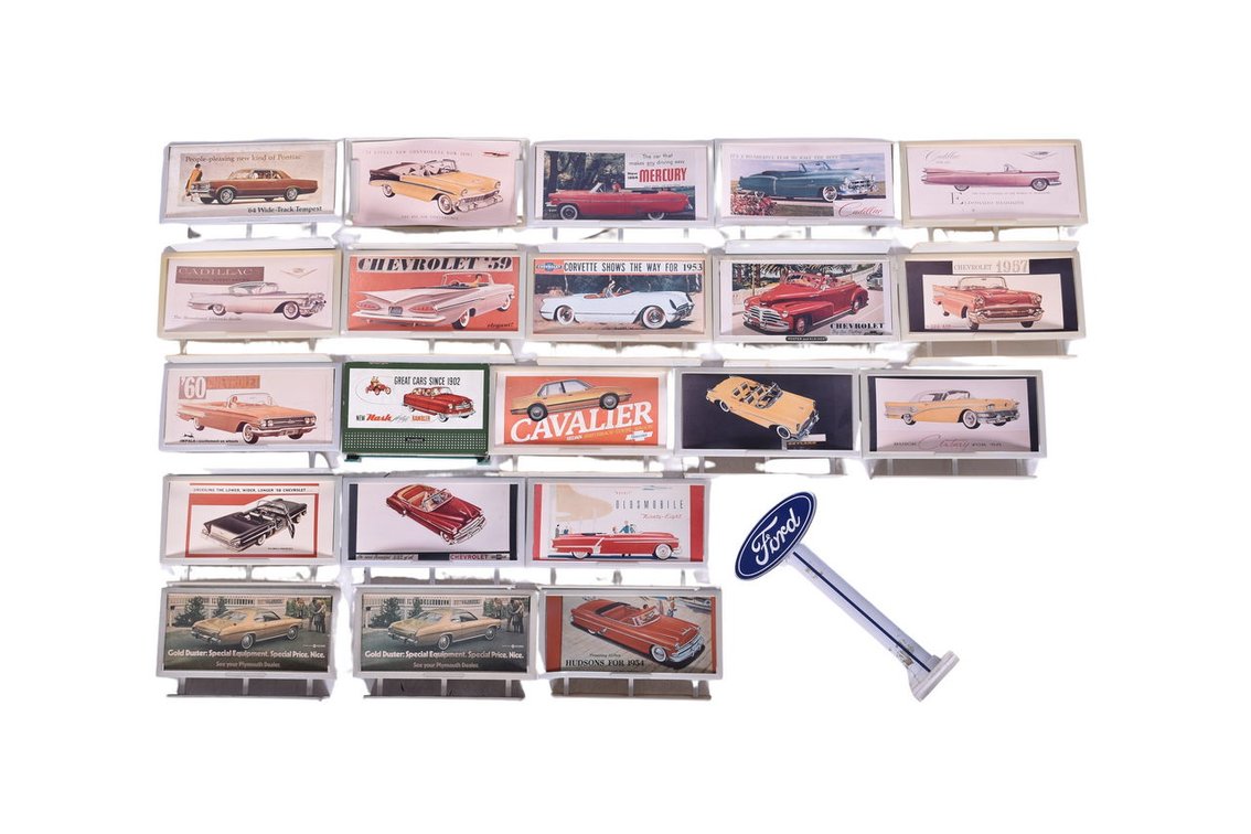 Group of 21 Miniature Billboard Automobile Advertisement Signs with 22 Billboard Inserts and Ford Dealership Sign