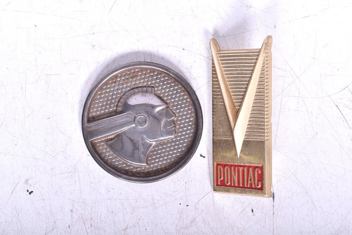 Two 1950s Pontiac Car Door Panel Emblems