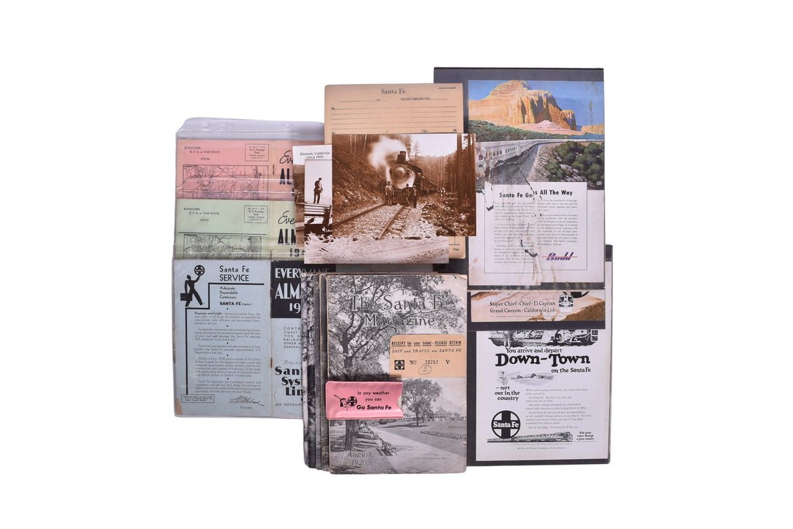 Group Of Santa Fe Railroad Ephemera- Five Issues Of The Santa Fe Magazine Dating From 1920-1956, Three Everymans Almanacs From1934,1945 and 1946, Postcards, etc.