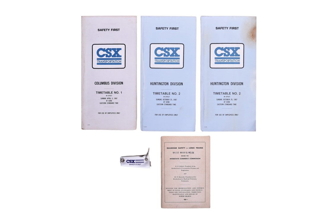 Group of CSX Railroad Memorabilia- Three Timetable Booklets, Railroad Safety Book From 1955 And A Nail Clipping Safety Award