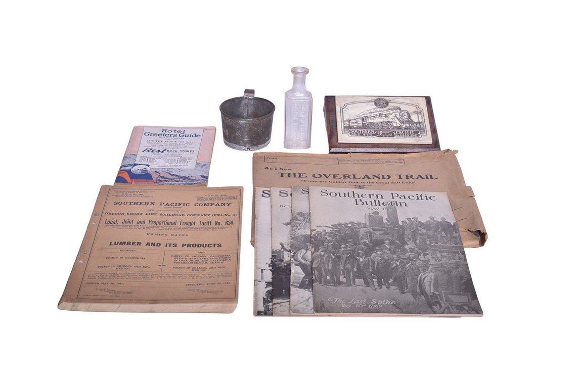 Group Of Southern Pacific Railroad Memorabilia -Medicine Bottle, Hotel Greeters Guide, Tin Cup, Southern Pacific Bulletins From 1928-1930 etc.