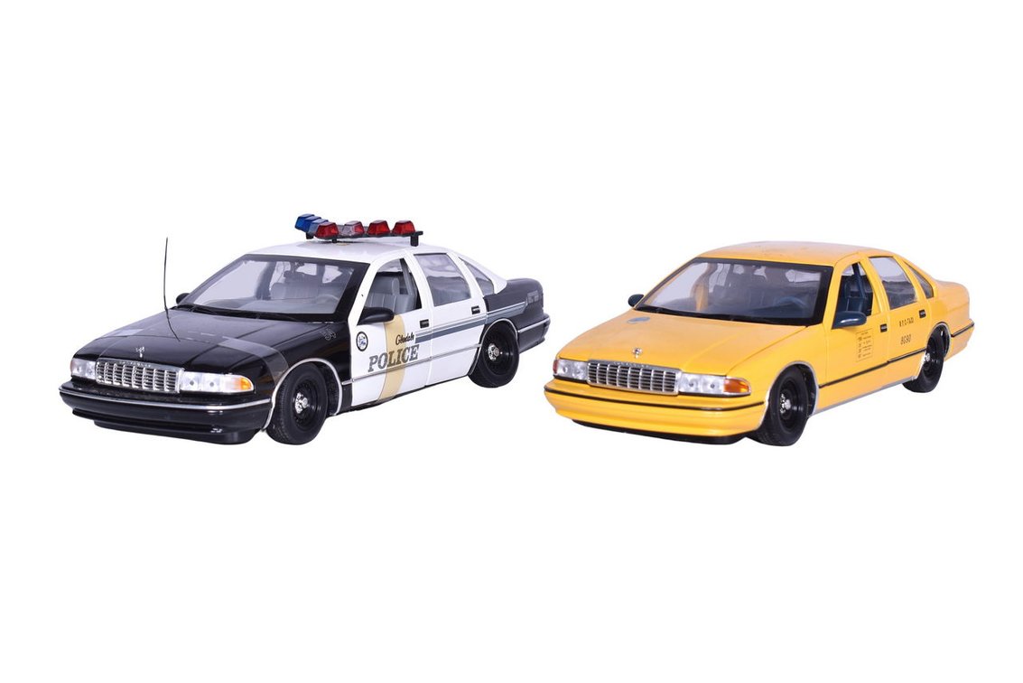 Two UT Models 1:18 Die Cast Chevrolet Caprice Models - Police and Taxi