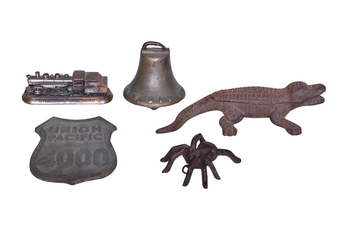 Group Of Five Cast Iron Railroad Memorabilia Items- Chicago West Division Horse Car Bell, Monon Route Alligator Match Holder Reproduction, Union Pacific 4000 Emblem, Spider Paperweight,, Strasburg Railroad Paperweight