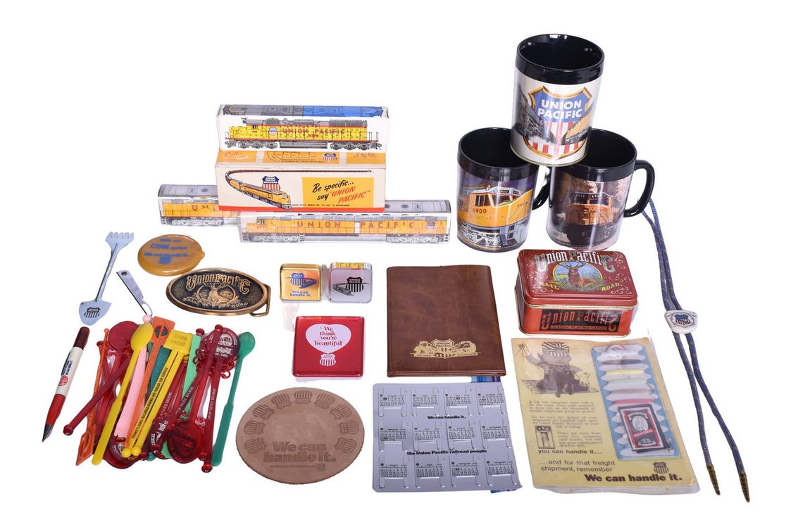 Union Pacific Memorabilia Group Of Twenty Plus Items- Belt Buckle, Playing Cards, Measuring Tape, Sewing Kit, Mugs, Etc.