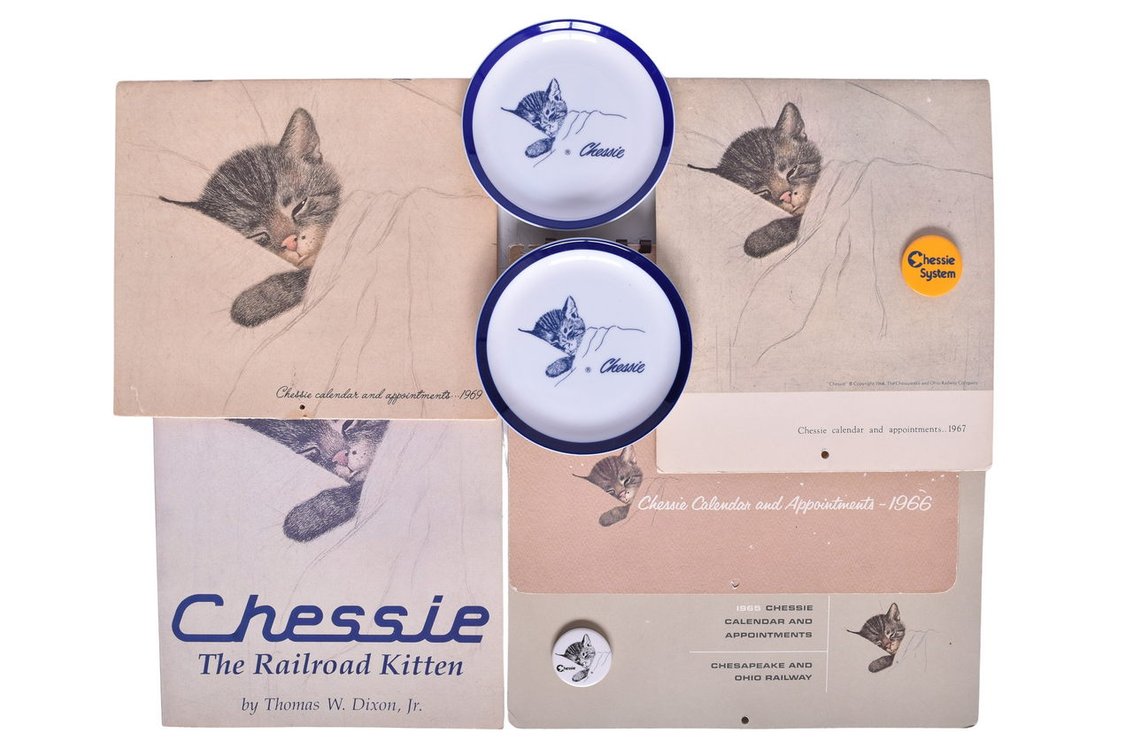 Chessie System Memorabilia Group Of Nine Items- Dishes, Buttons, The Railroad Kitten Book, 1960's Calendars