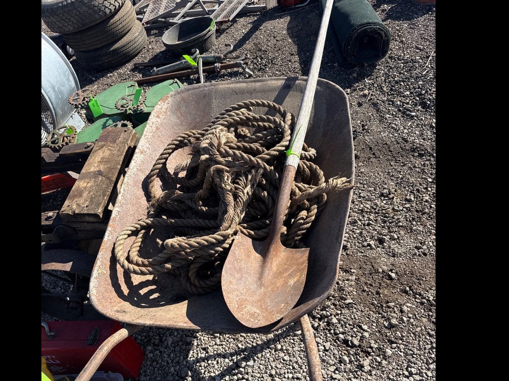 Wheel barrow, shovel, rope
