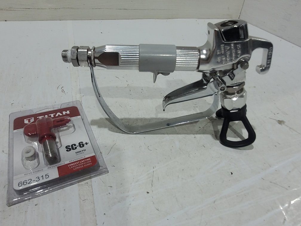 Paint sprayer nozzle and attachment