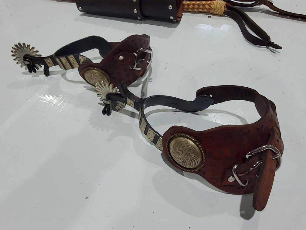 Western spurs and handmade straps