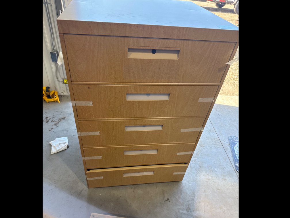 Metal cabinet with divided drawers