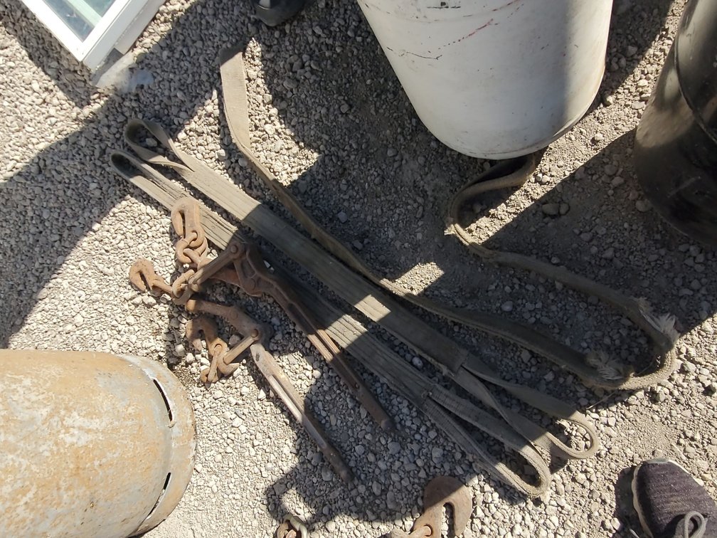 Tow straps and chain binders