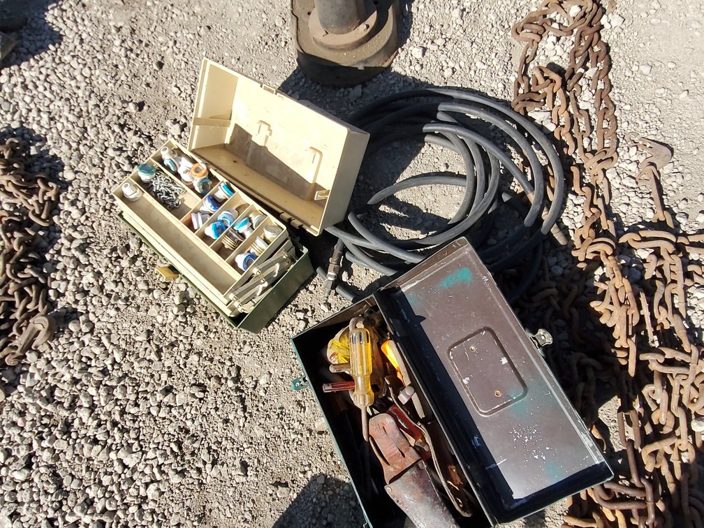 Tools boxes w/ fuses & tools. Air hose