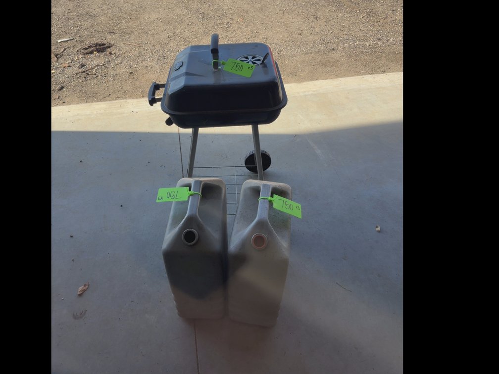 Charcoal grill, water cans