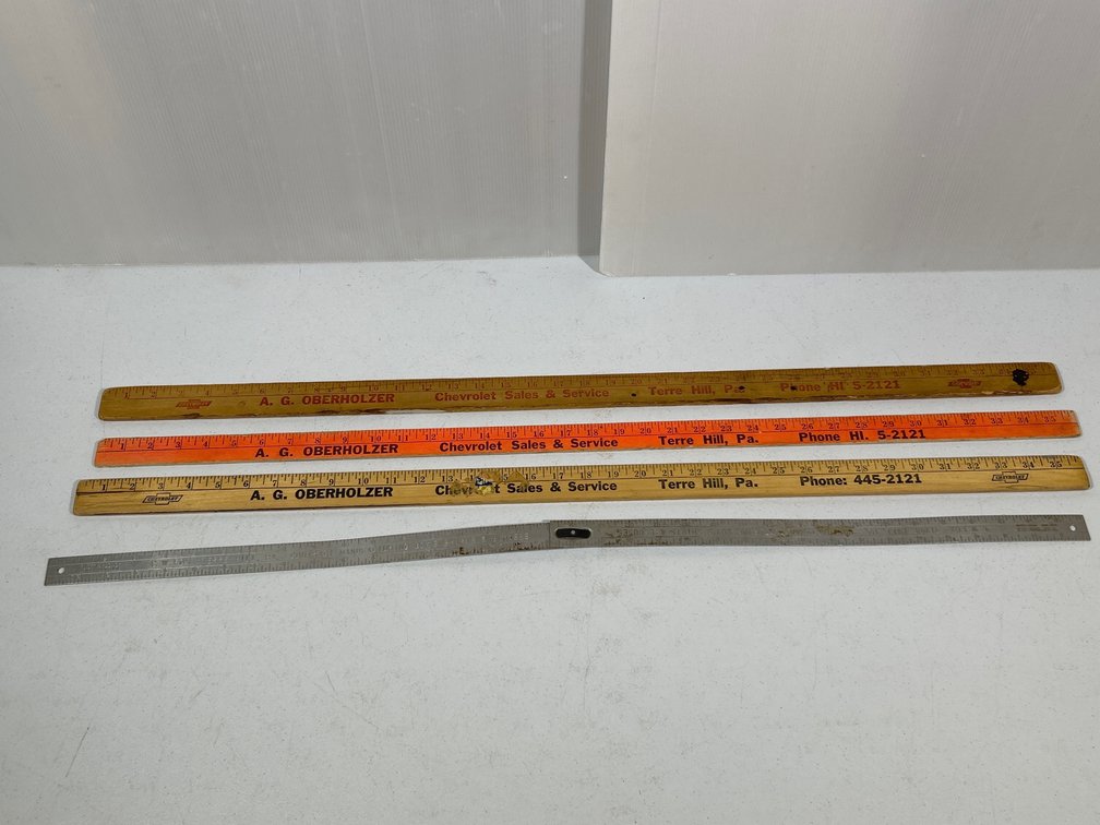 1 Metal "C.W. Fox" & 3 Wooden "A.G. Overholtzer" Advertising Yard Sticks
