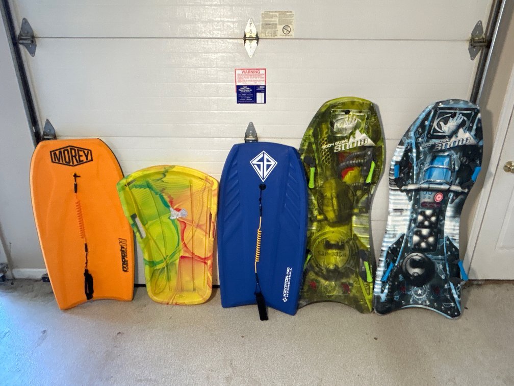 2 Boogie Boards, 2 Body Glove Snow Boards, Other Plastic Snow Board