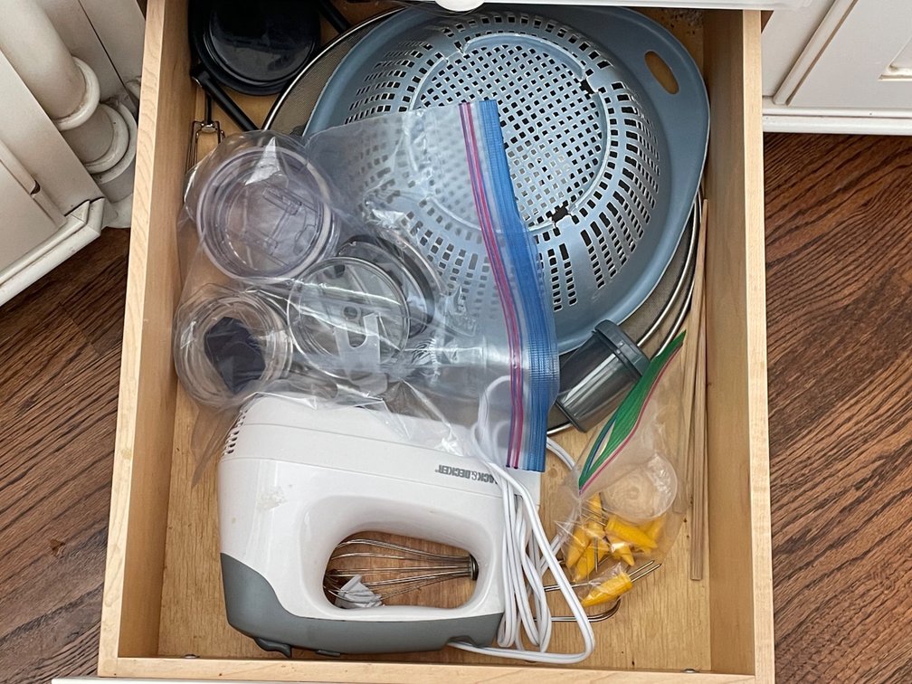 Contents of Drawer- Strainers, Corn Picks, Hand Mixer, Travel Cup Lids, More