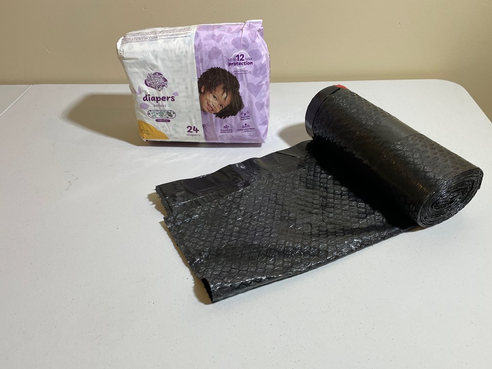 Always My Baby Diapers, Size 5 and Roll of Black Trash Bags