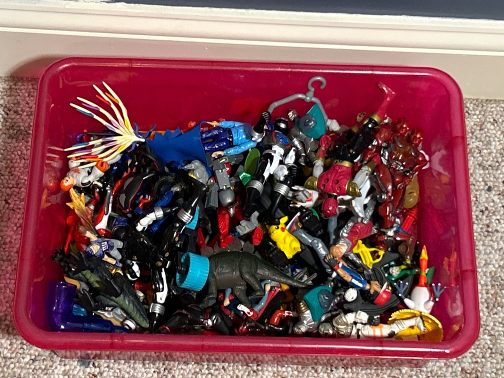 Red Plastic Bin with Assorted Figures