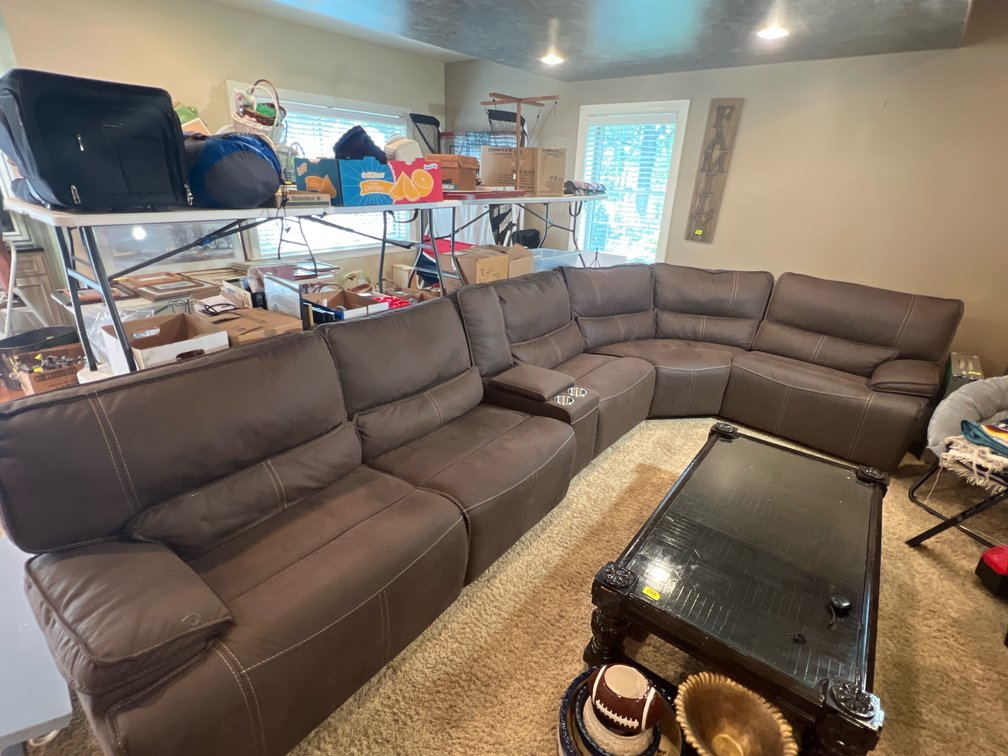 Multi-piece brown upholstered reclining sectional sofa