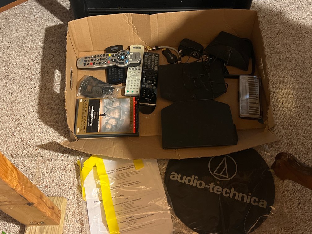 Box with Remote Controls, Chargers, More