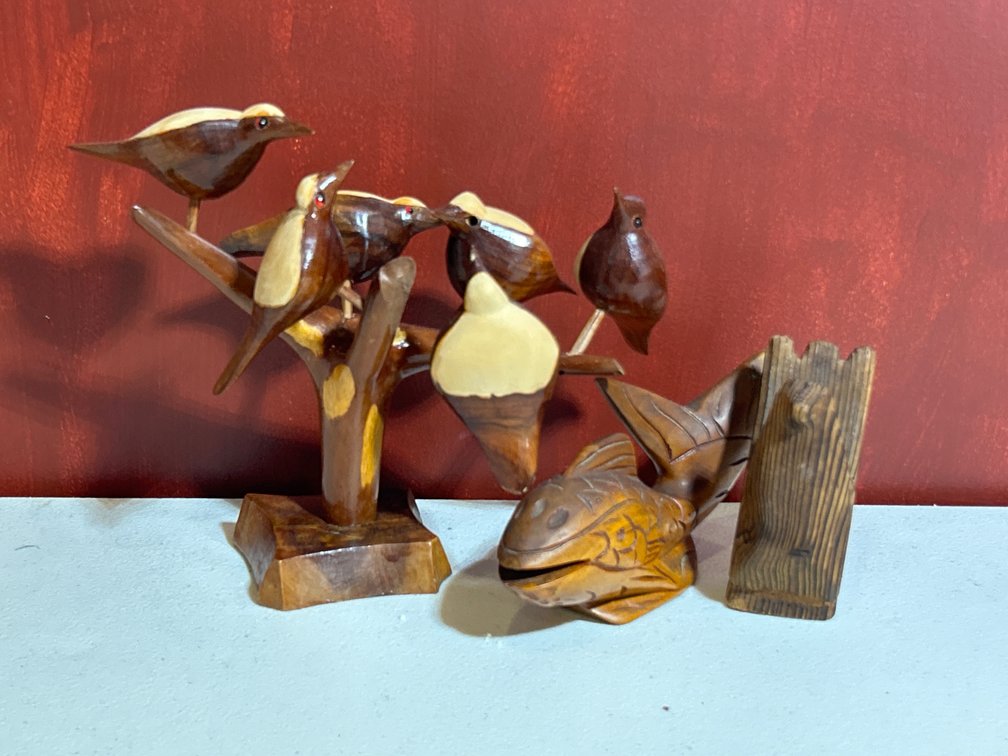 Three carved wooden decorative items