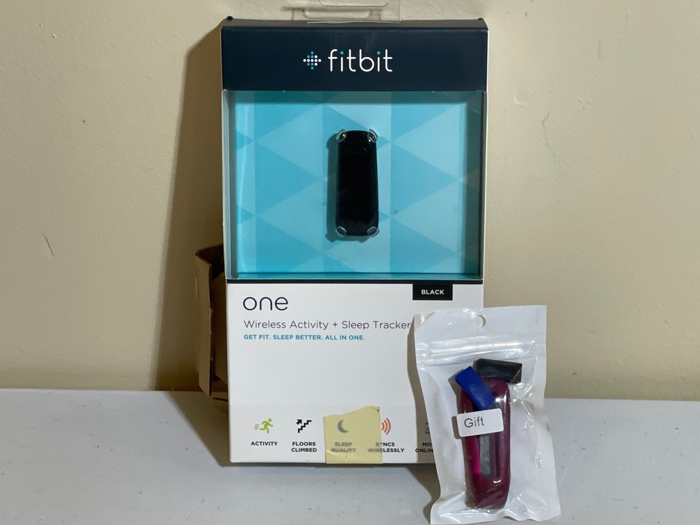 Boxed Fitbit One wireless activity and sleep tracker