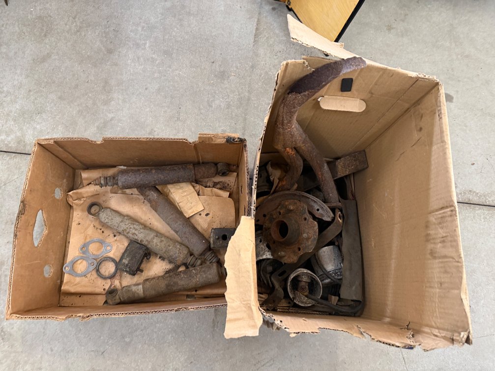 Multi-Box Lot of Vintage Shock Absorbers, Brake Backing Plates, and Steering Components