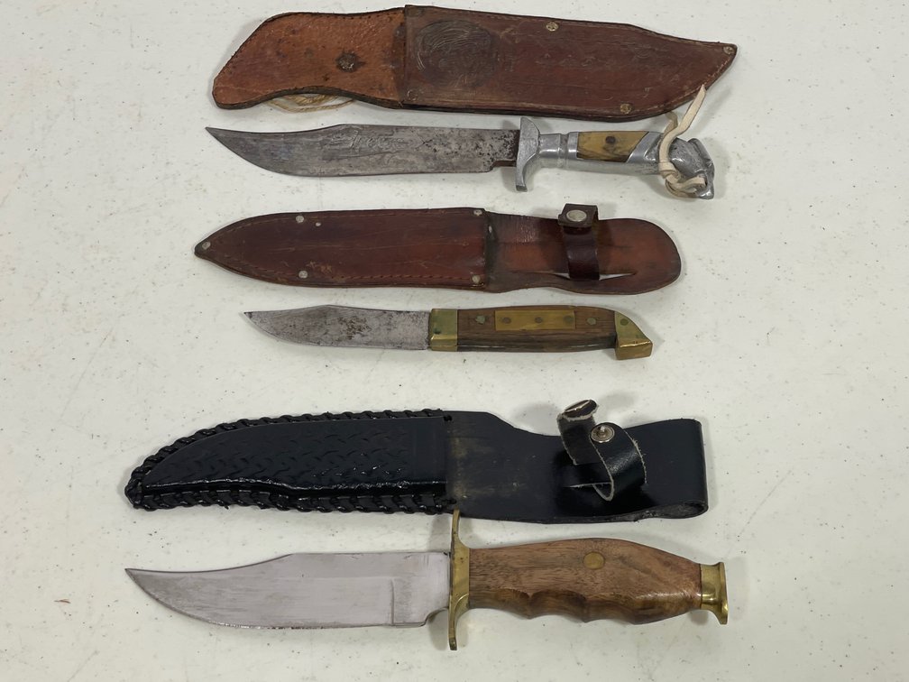 3 Knives with Sheaths- 2 are Brown Leather Sheaths, One is Black Leather
