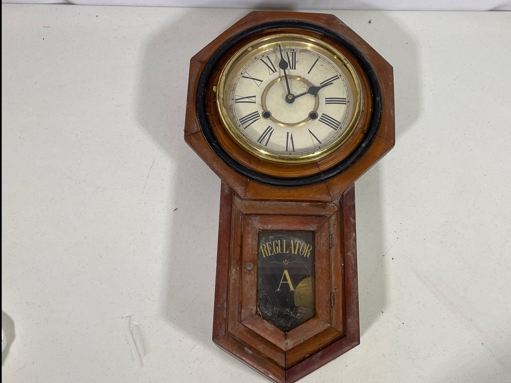 Regulator A Octagonal Wall Clock with Pendulum and Key