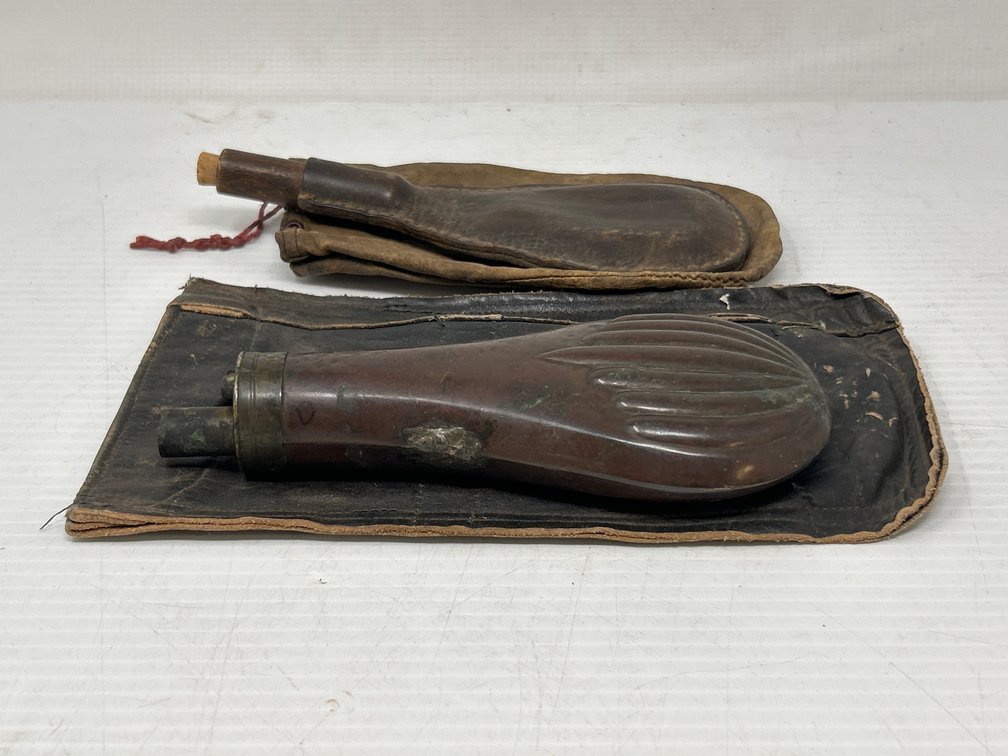 2 Powder Horns- One Leather, Other Metal, Both with Leather Pouches