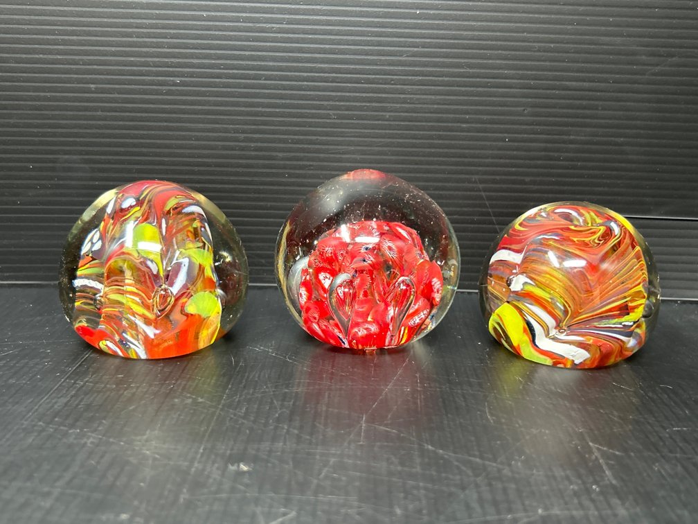 3 Art Blown Glass Paperweights- 2 Have Red/Yellow Swirls, One has Red/White Flowers