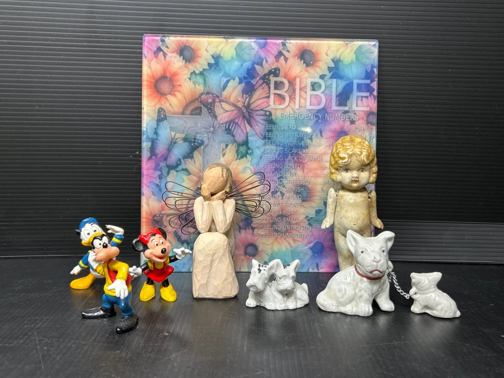 Figures Lot and Sign "Bible Emergency Numbers"