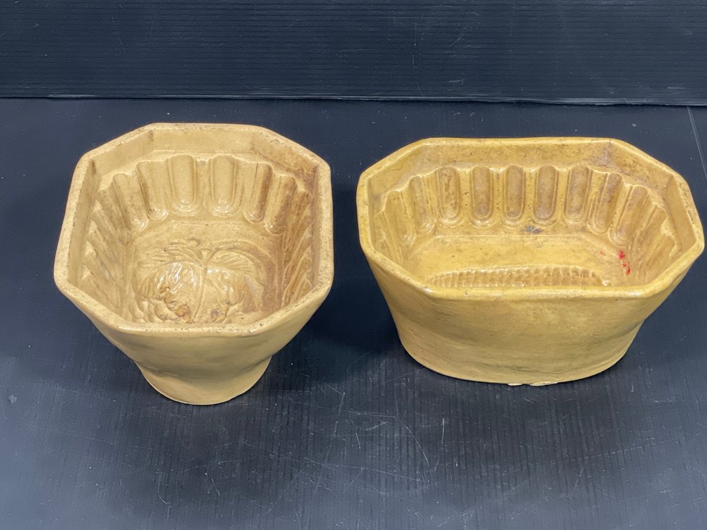 2 Yellow Ware Molds- One with Grape Cluster Motif, Other with Corn Motif