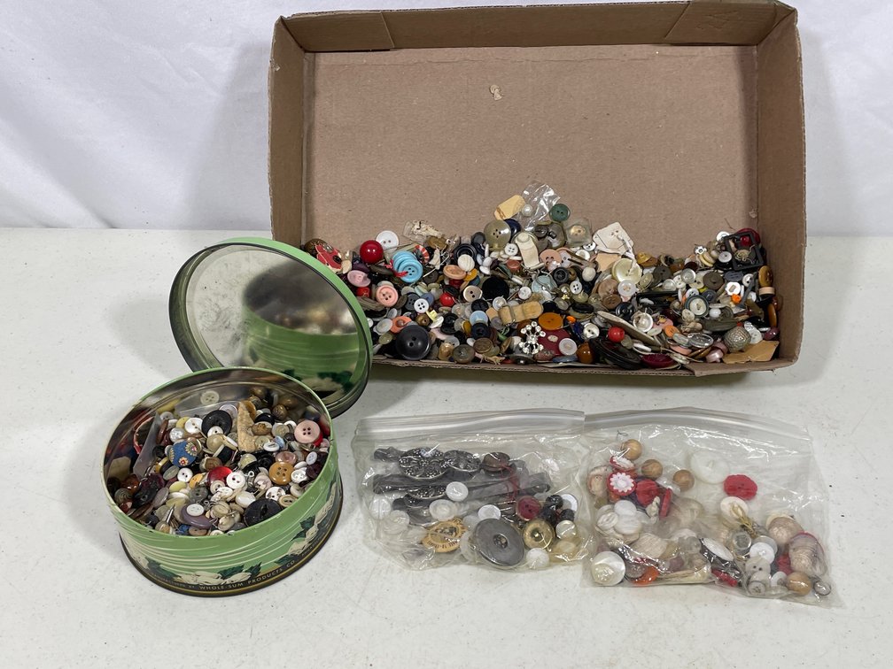 Green Lidded Tin, 2 Plastic Bags and Cardboard Box Full of Assorted Buttons