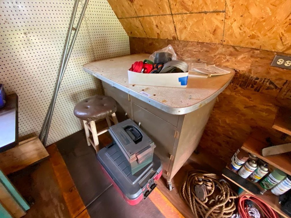rolling metal cabinet and two boxes