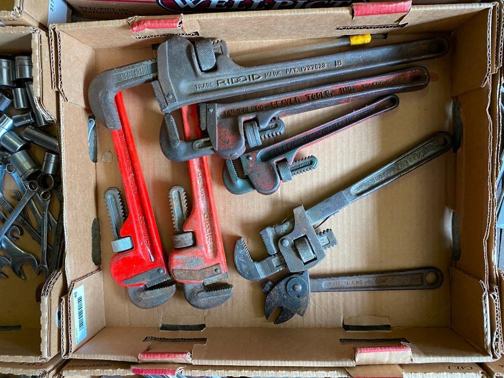 Box of pipe wrenches.
